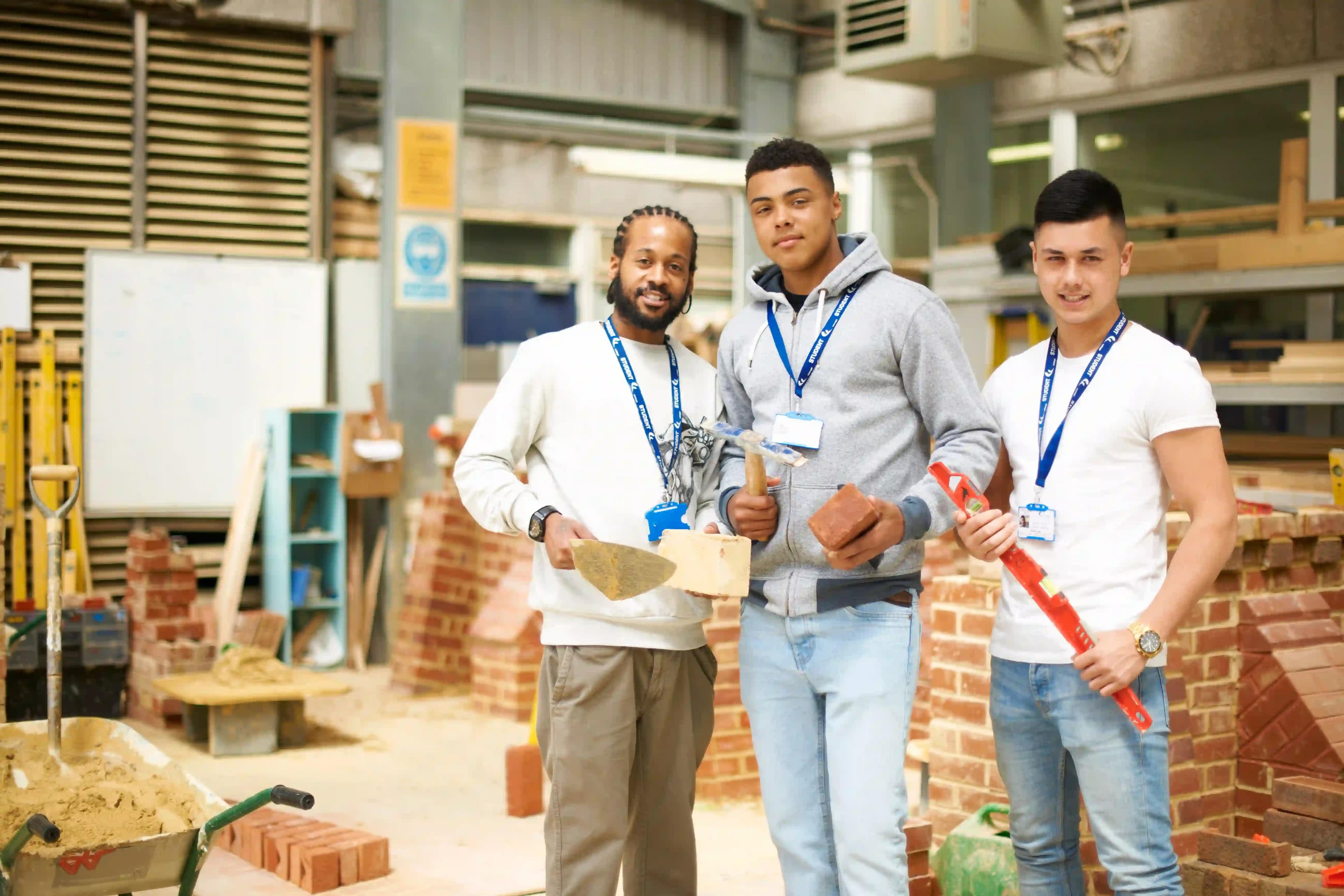 three construction apprentice students in bricklaying