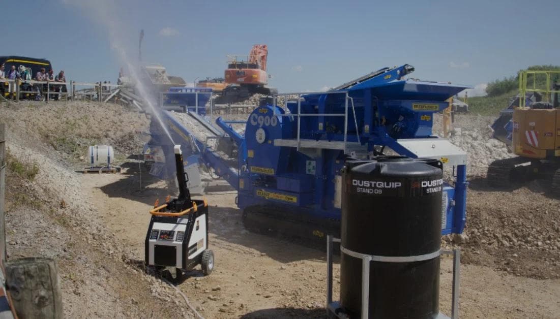Using a dust suppression system - JetMister from Dustquip spraying water on a crusher to reduce dust