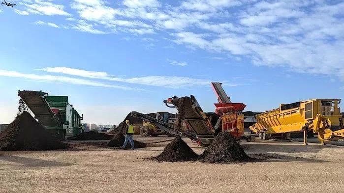 3 large trommels working to screen and separate compost