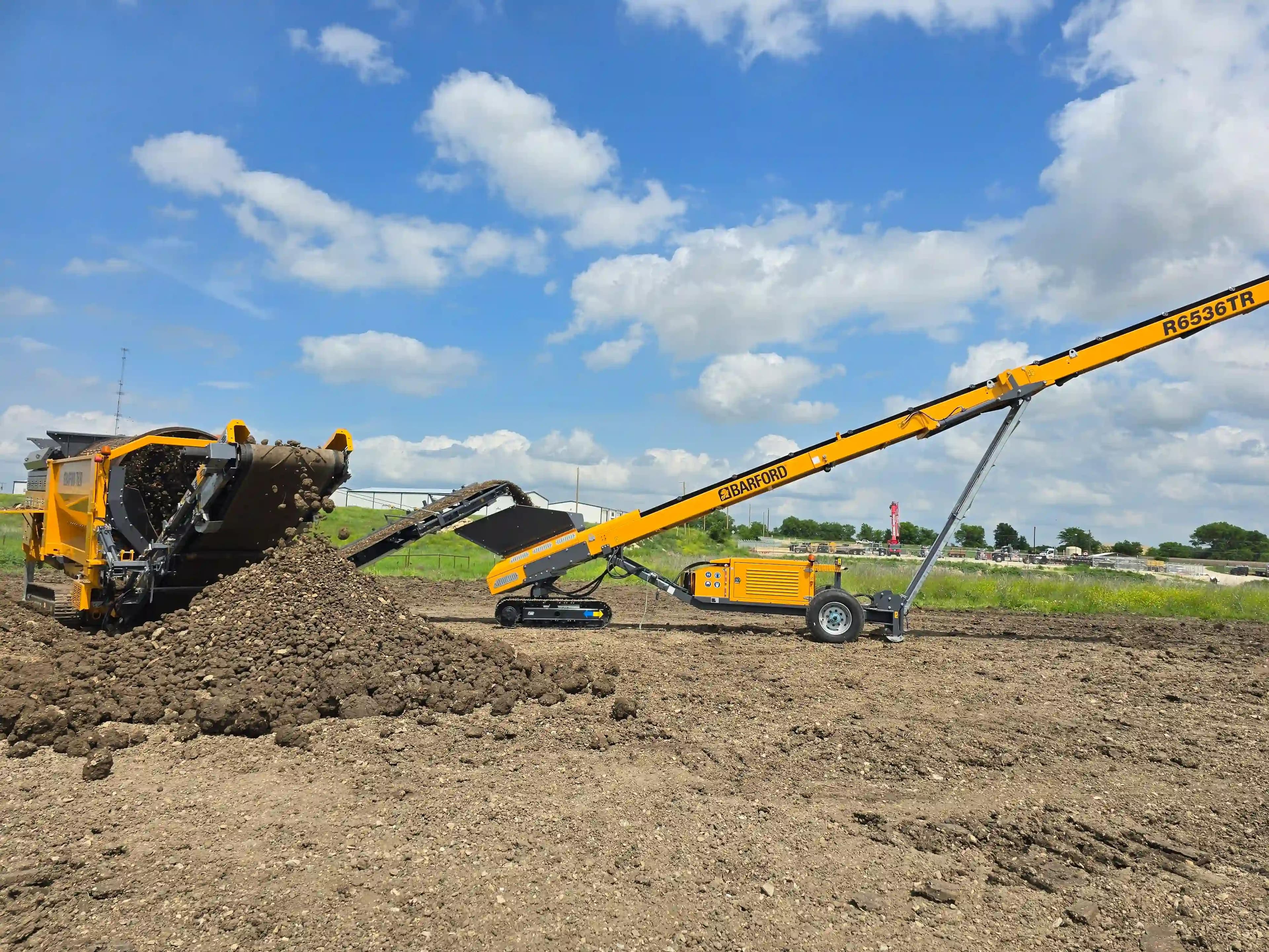 Barford t620 trommel screening compost and a Barford r6536tr radial stacker stockpiling the material