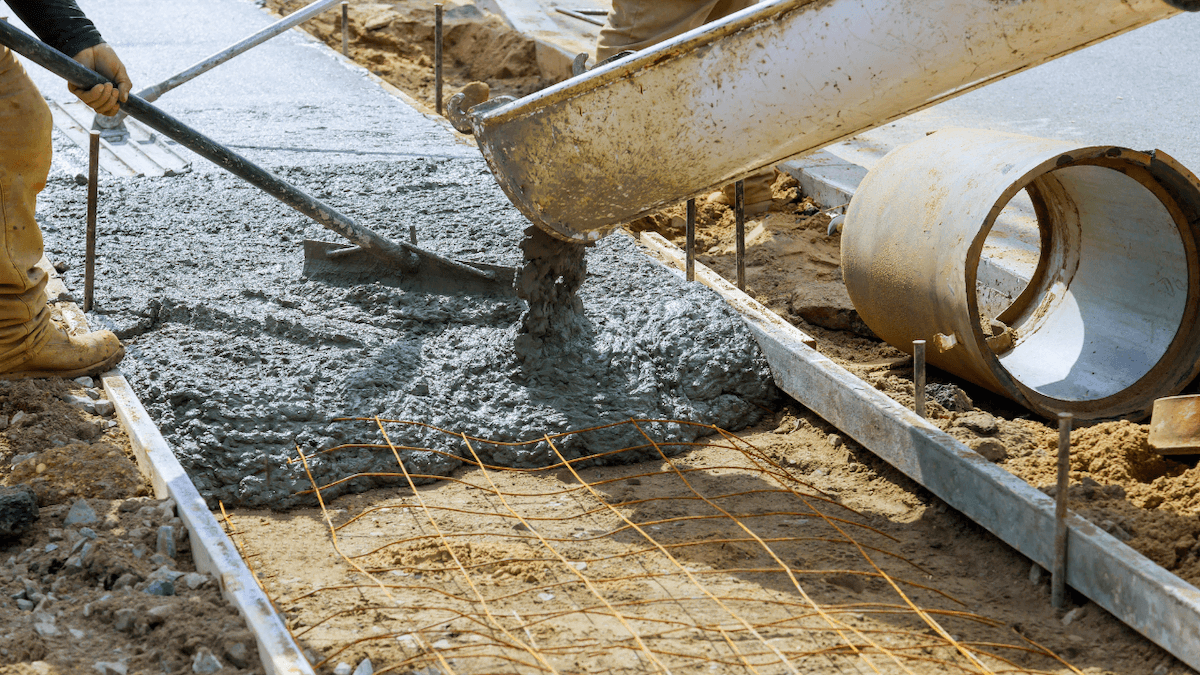 pouring concrete from a concrete batch plant into a mold