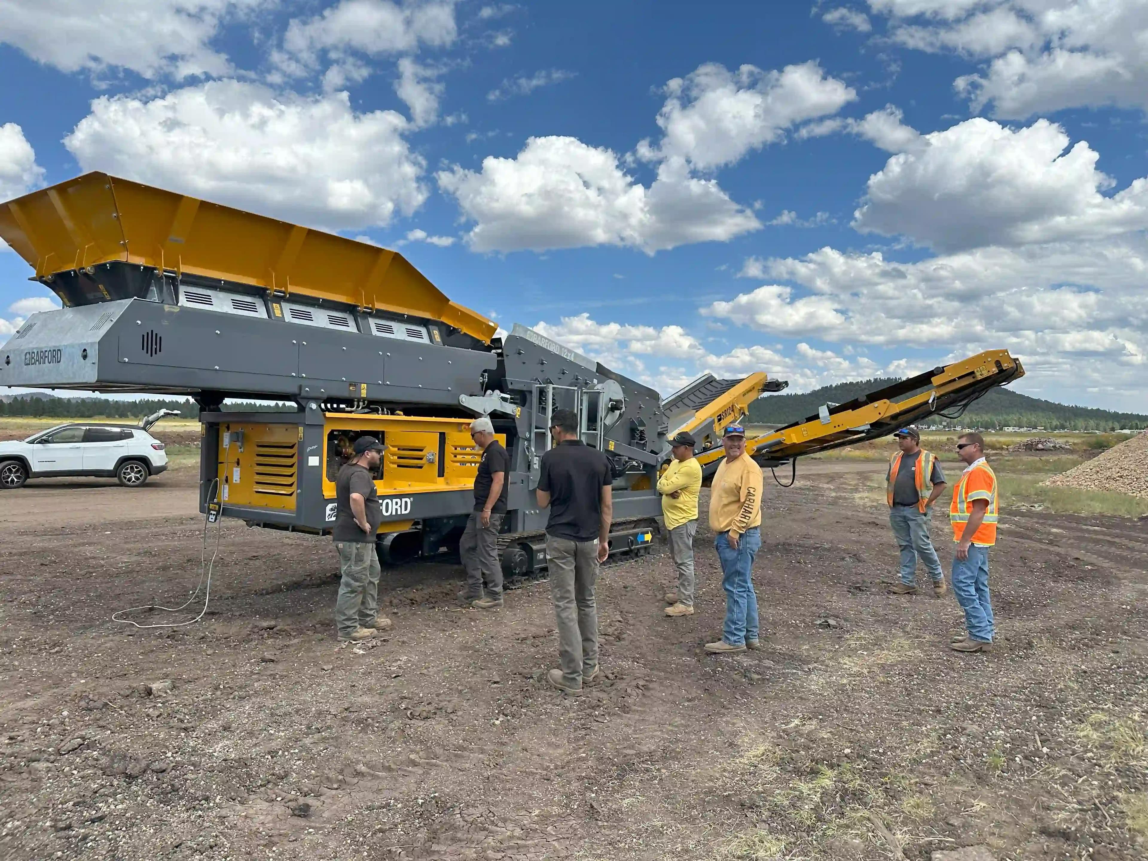 service engineer from machinery partner shows team and new customer how to run their new Barford sr124 3-way scalping screen