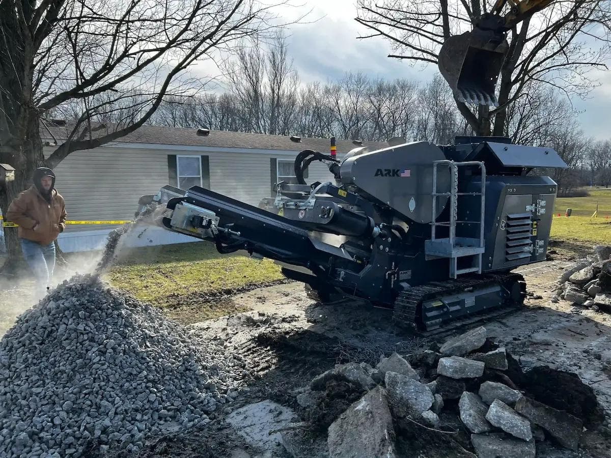 gray ark 2416 jaw crusher crushing rockand concrete on a residential site