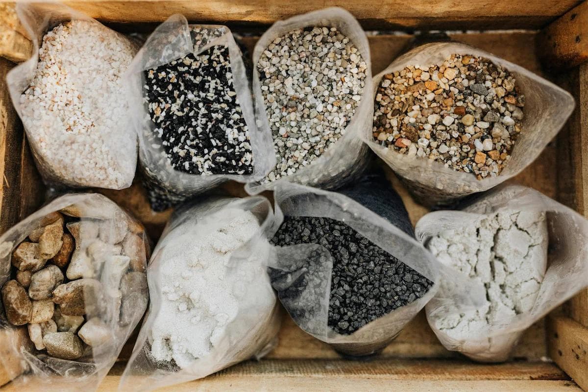 different kinds of stones all in bags