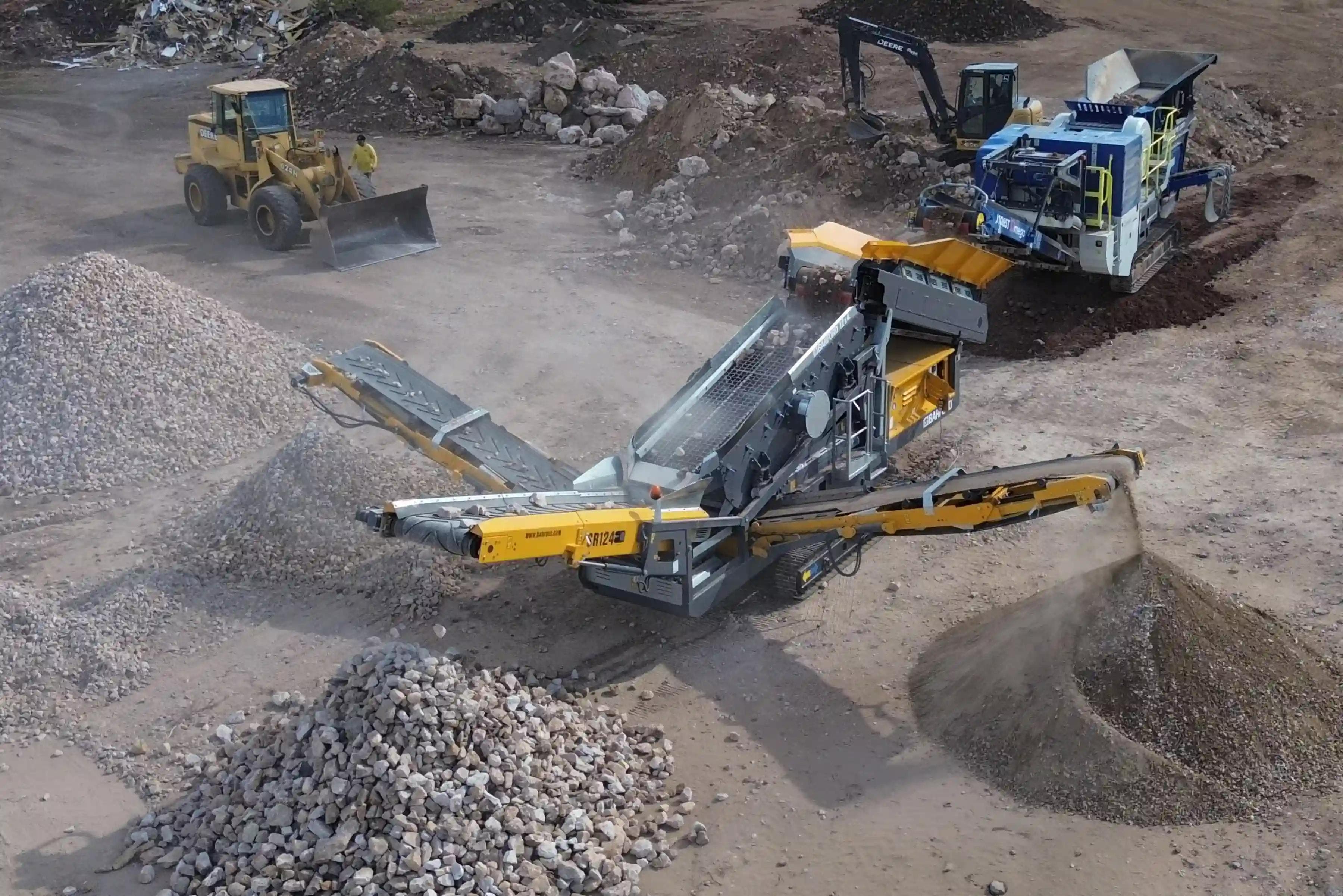 Barford SR124 Scalping Screen and Omega J1065T Jaw Crusher working in tandem to crush and screen rock and concrete into 3 different sized materials