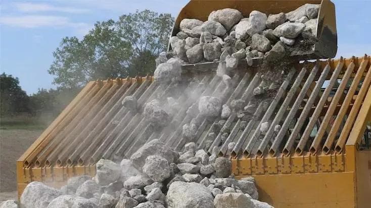 rocks being separated by orange grizzly bars