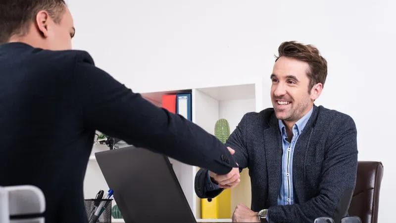 two men shaking hands in agreement
