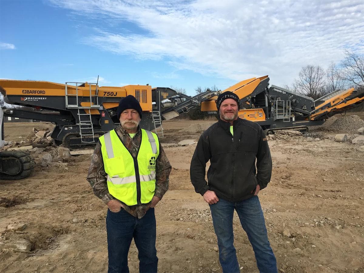 Dennis and his service tech Rick with his crusher & screener combo