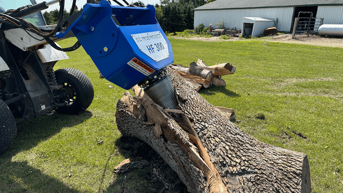 blue u.s. pride cone splitter splitting a large log