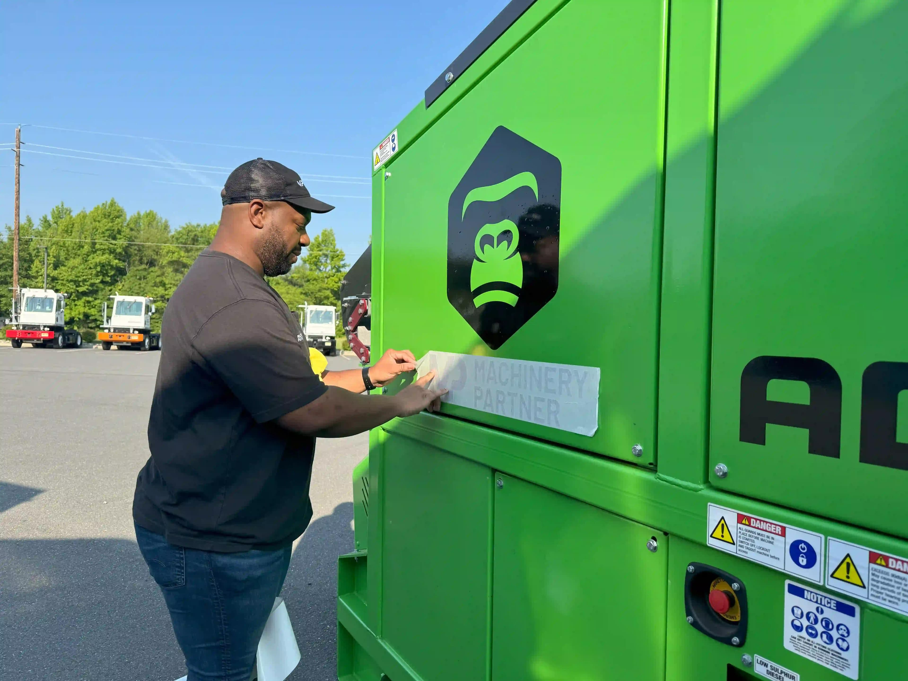 placing a machinery partner decal sticker on the gorilla screener machine